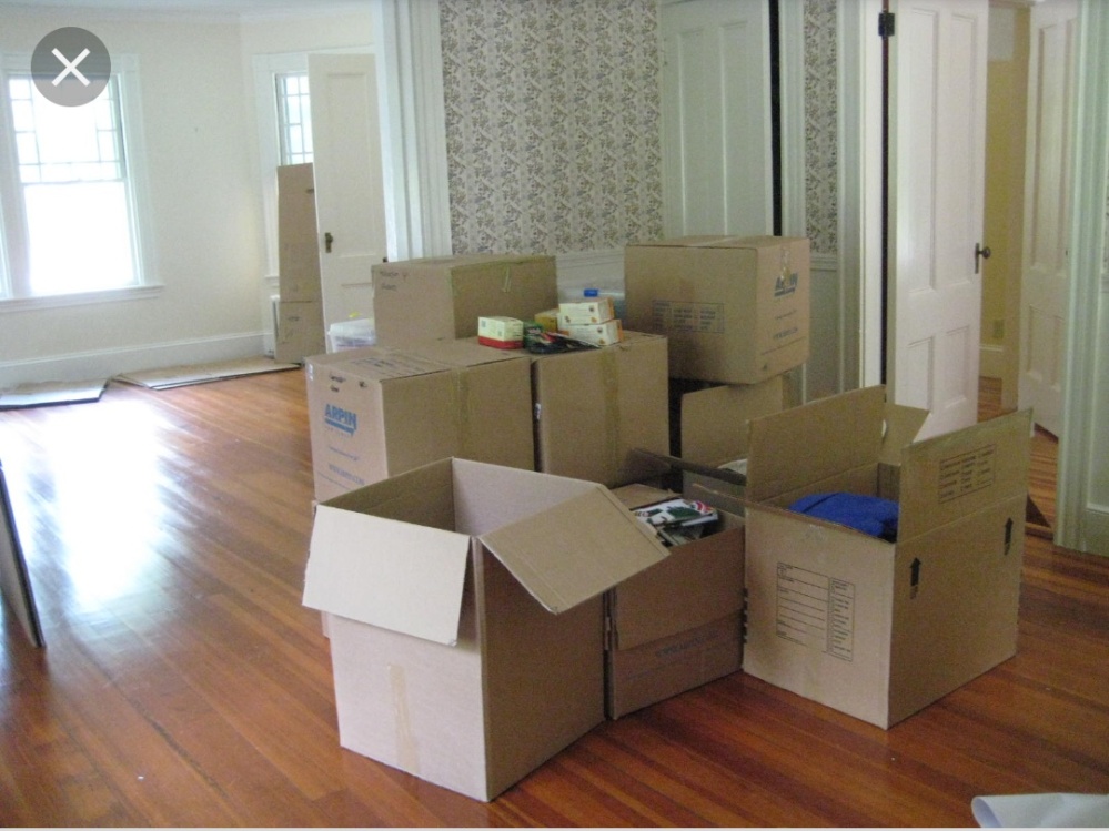 Ross Geller moving into Rachel Greene's apartment. A pile of half opened boxes when moving into a new place